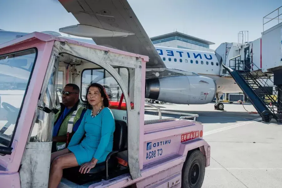 Melinda Yee Franklin sitting in a cart.